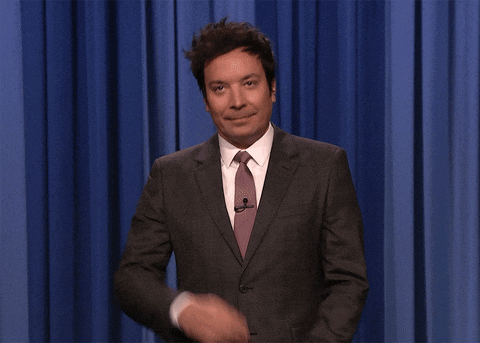 Animated GIF of Jimmy Fallon giving a two-finger peace sign goodbye