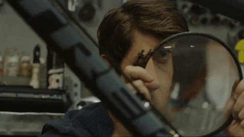Animated GIF of someone leaning in to inspect something closely